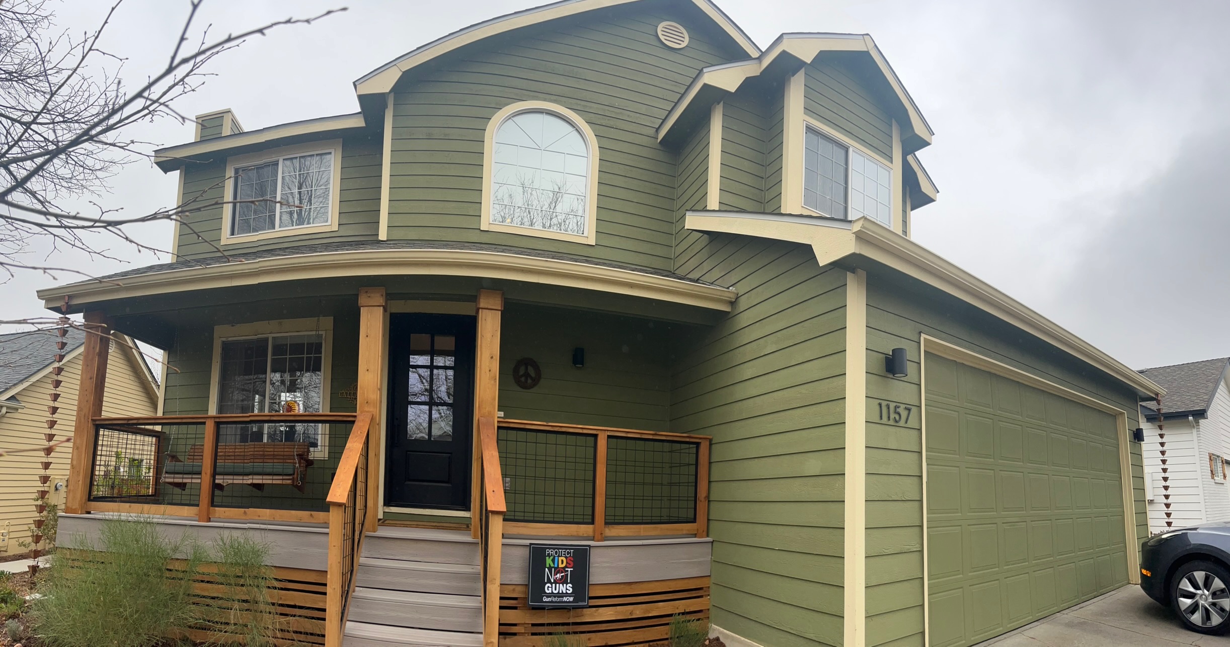Green exterior house painting with cedar accents in Fort Collins Colorado